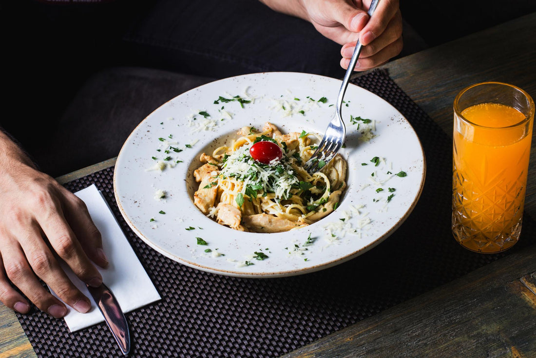 recipe-pasta-with-chicken-tomatoes-greens-grated-cheese-served-with-juice-salad